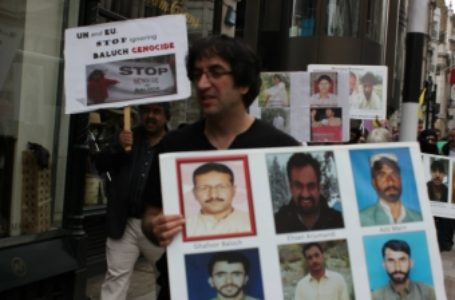 Baloch activists holding pictures of abducted Baloch